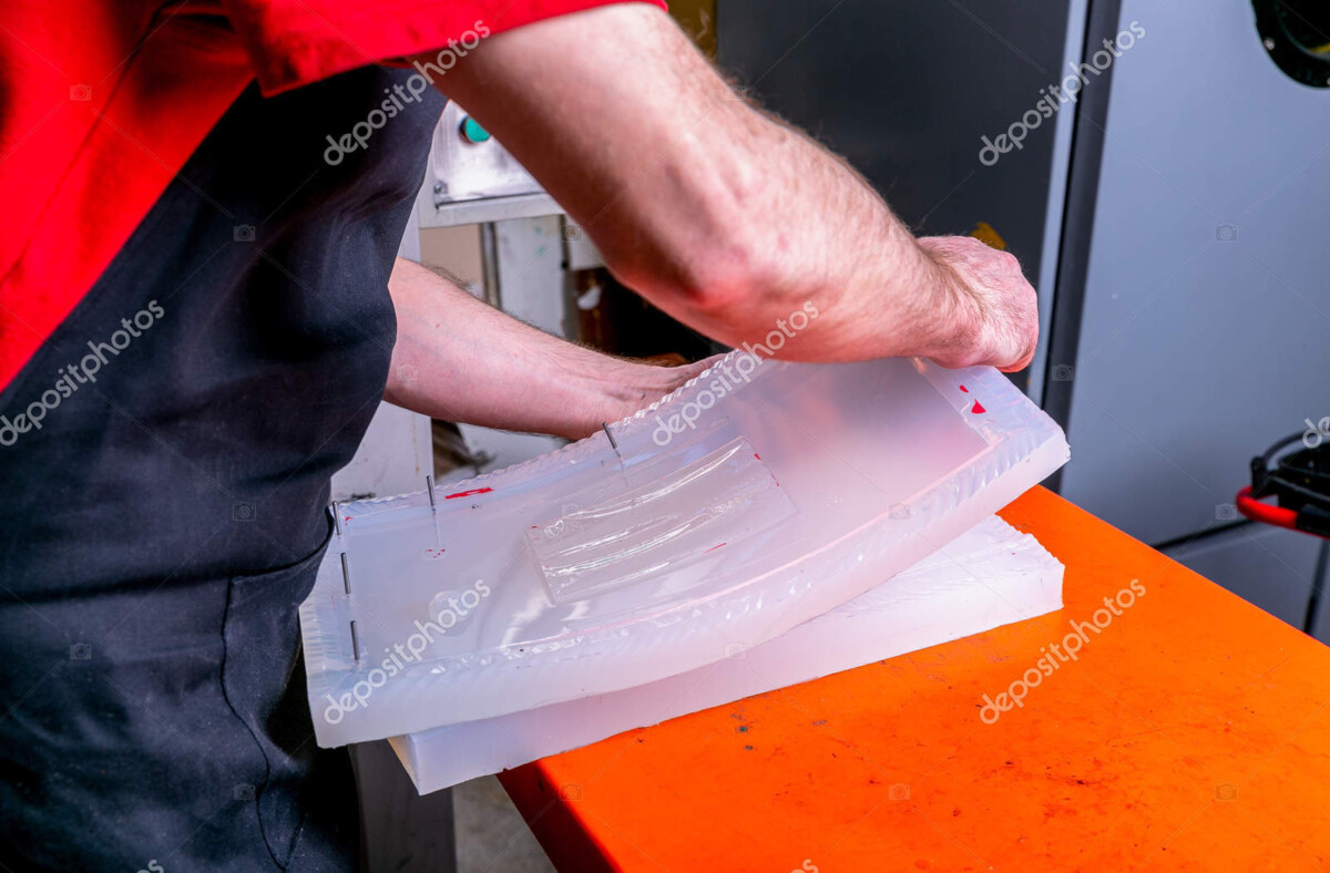 depositphotos 266706050 stock photo a worker seals the mold