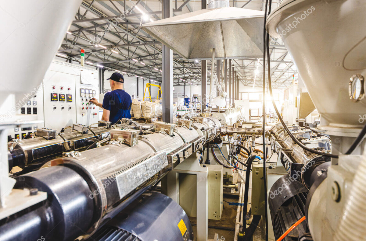 workshop with extruders for producing plastic pipes. high speed extrusion line of water suppply and gas pipe. manufacturing facility.